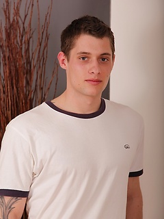Sexy college guy Jace jerks off in front of the fireplace.